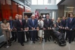 Mike Lazaridis, Stephen Hawking, and others cutting the ribbon for the Mike & Ophelia Lazaridis Quantum-Nano Centre grand-opening